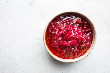 Wall Mural - Traditional Ukrainian Russian vegetable beet soup, borscht on white background, top view