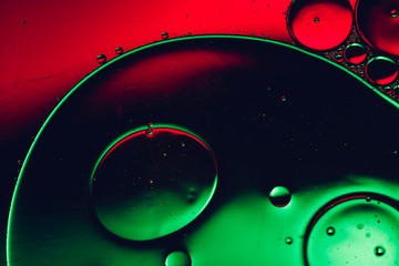colorful abstract background, red and green surreal shiny metallic liquid macro photography