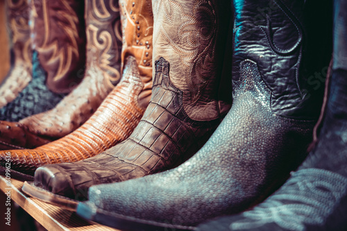 Cuadros en Lienzo Cowboys boots on a shelf in a store