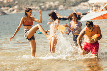 Happy friends having fun on beach