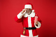 © ViDi Studio - Elderly gray-haired mustache bearded Santa man in Christmas hat 3d imax glasses isolated on red background. New Year 2020 celebration concept. Mock up copy space. Watching movie film hold cup of soda.