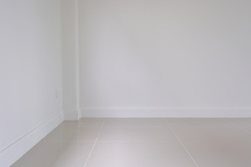 empty room interior, white mortar wall and clean tile floor in a new house