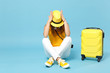 © ViDi Studio - Traveler tourist woman in yellow casual clothes, hat with suitcase photo camera isolated on blue background. Female passenger traveling abroad to travel on weekends getaway. Air flight journey concept