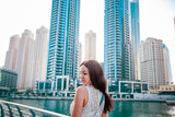Fototapeta Miasta - Enjoying travel in United Arabian Emirates. Happy woman