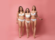 © New Africa - Group of women with different body types in underwear on pink background