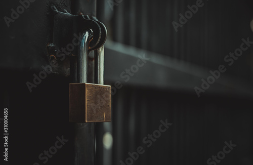 Closeup steel door with lock , padlock , key lock , dark background Tableau sur Toile
