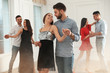 © New Africa - Lovely young couple dancing together at party