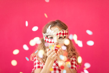 Poster - Fancy girl blowing confetti against pink bakground