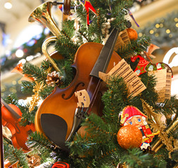 Wall Mural - Christmas and New Year. Amazing Christmas tree with musical decorations and violin