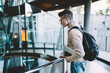 © GalakticDreamer - Young male looking down and standing on floor with glass fence