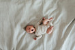 © Johnér - Baby lying on bed