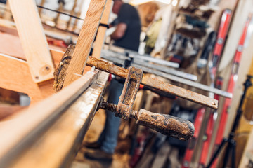 Poster - Clamps holding wood together in a workshop