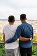 © Westend61 - Back view of gay couple looking arm in arm at the city, Barcelona, Spain