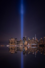 USA, New York, New York City, Manhattan Skyline With Tribute In Light At Night