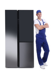 Canvas Print - Professional worker near refrigerator on white background