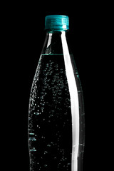 plastic bottle of water isolated on a black background. Image for design.