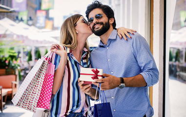 young couple in shopping. consumerism, love, dating, lifestyle concept