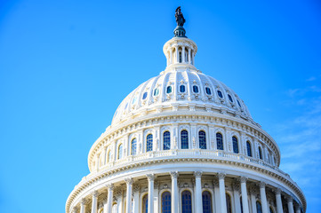 East side of the US Capital dome with blue sky background