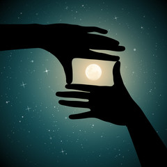 Canvas Print - Moon in framing hands on starry background. Vector illustration with hand gesture silhouette showing rectangular frame and Earth satellite on moonlit night. Full moon in starry sky