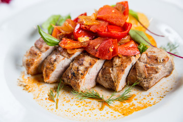 Roasted pork fillet with vegetables on a plate