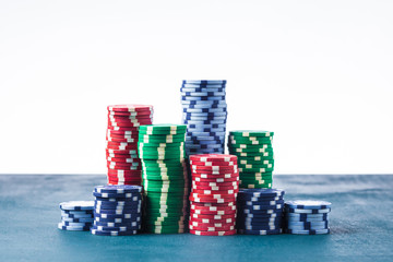 Stack of poker chips on the table on a white background isolate