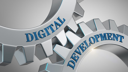 Digital development concept. Words digital development written on gear wheels.