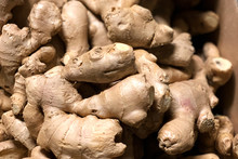 A Box With A Bunch Of Dry Brown Ginger Roots On A Counter In A Greengrocer