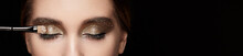 Makeup Artist Applies Eye Shadow. Beautiful Woman Face. Perfect Makeup. Lips. Cosmetic Eyeshadow. Make-up Detail. Eyeliner