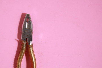 old pliers in color background