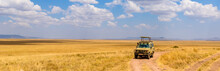 Safari Tourists On Game Drive With Jeep Car In Serengeti National Park In Beautiful Landscape Scenery, Tanzania, Africa