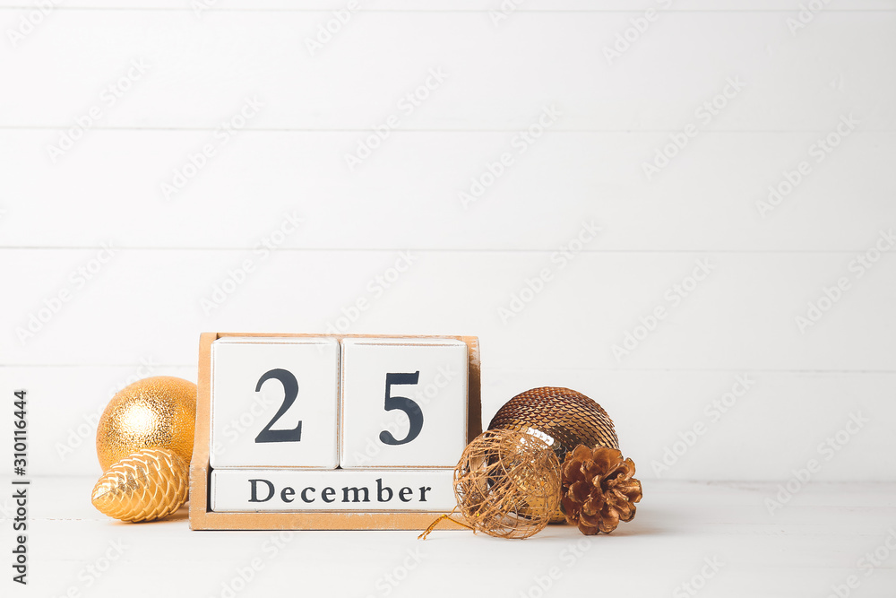 Christmas decor and calendar on table