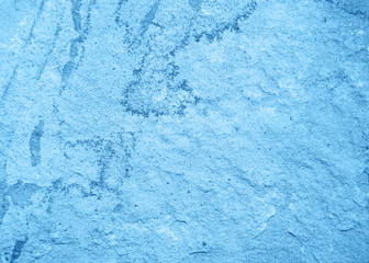 Ancient stone wall toned classic blue color