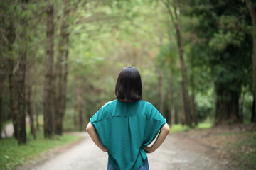 young cute Japanese Asian hipster girl travelling at beautiful sky  mountains scenery park hiking garden views at Kanchanaburi Thailand guiding idea for female backpacker woman women backpacking