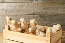 Box With Fresh Ginger On Wooden Background, Closeup