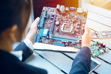 Engineer inspect final production of Printed circuit computer logic board prepare for mass production process.