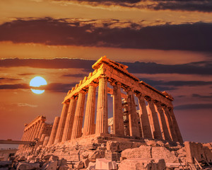 Parthenon ancient temple facade under dramatic fiery sky, Athens acropolis Greece