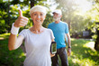 © NDABCREATIVITY - Active mature couple running in the park for helathy life