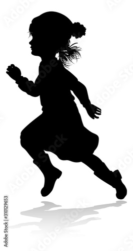 A child in silhouette playi...