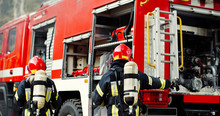 Firefighter Training, Rescue In Uniform And Helmet Near Fire Engine In Action