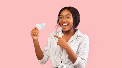 Positive Black Girl Showing Credit Card Standing, Pink Background, Panorama