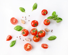 Ripe Red Cherry Tomatos  And Basil On White Background. Top View