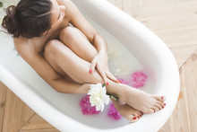 Perfect Woman Bathing With Flowers And Milk