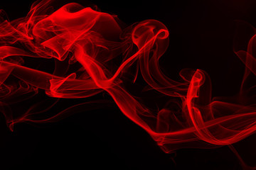 Wall Mural - Movement of red smoke on black background. fire design