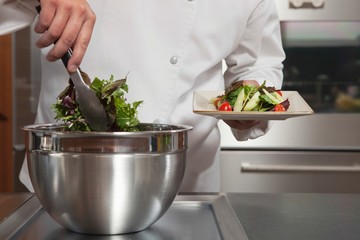 Wall Mural - Chef Preparing Leaf Vegetables In Commercial Kitchen