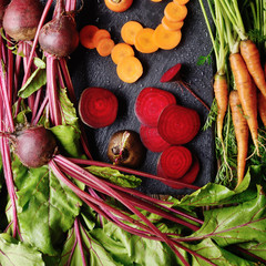 Wall Mural - Top view at vegetable background of beets and carrots on kitchen table close up view