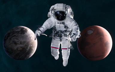 Wall Mural - astronaut on background of mars and earth. solar system. 3d render. science fiction. elements of thi