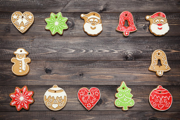 Wall Mural - Christmas gingerbread cookies on brown wooden table