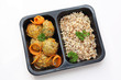 Dietary chicken meatball with vegetables. Easy-to-digest diet in a box. Ready meal in a box on a white background.