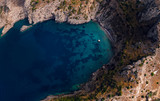 Fototapeta Boho - Beautiful top down aerial view of wilderness bay and mountains on sunrise, hiking to a wild beach, tourist destination place for snorkeling and kayaking. Nerano, Massa Lubrense, Ieranto bay, Italy