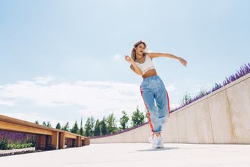 athletic girl jogging on park paths on a clear day